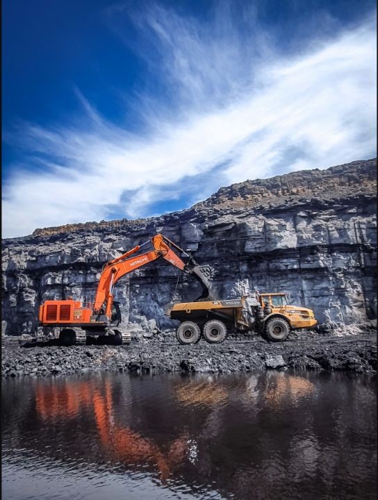 Articulated dump truck being loaded